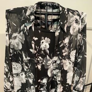 Sleeveless top with sheer over blouse.